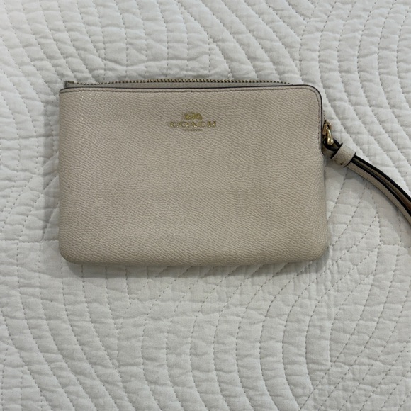 Coach Handbags - Coach Beige Wristlet with Gold Accents